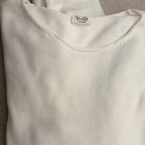 Off white long sleeve knit top.